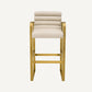 Chaise de bar dorée en tissu sable
