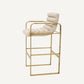 Chaise de bar dorée en tissu sable